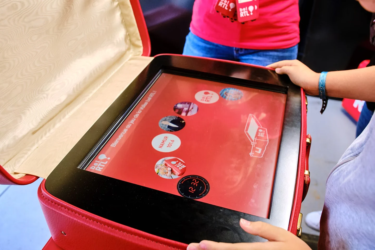 Close-up of the touch game interface inside the branded suitcase
